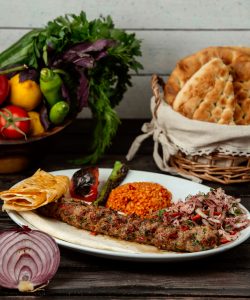 bulgur meat onions on a wooden table